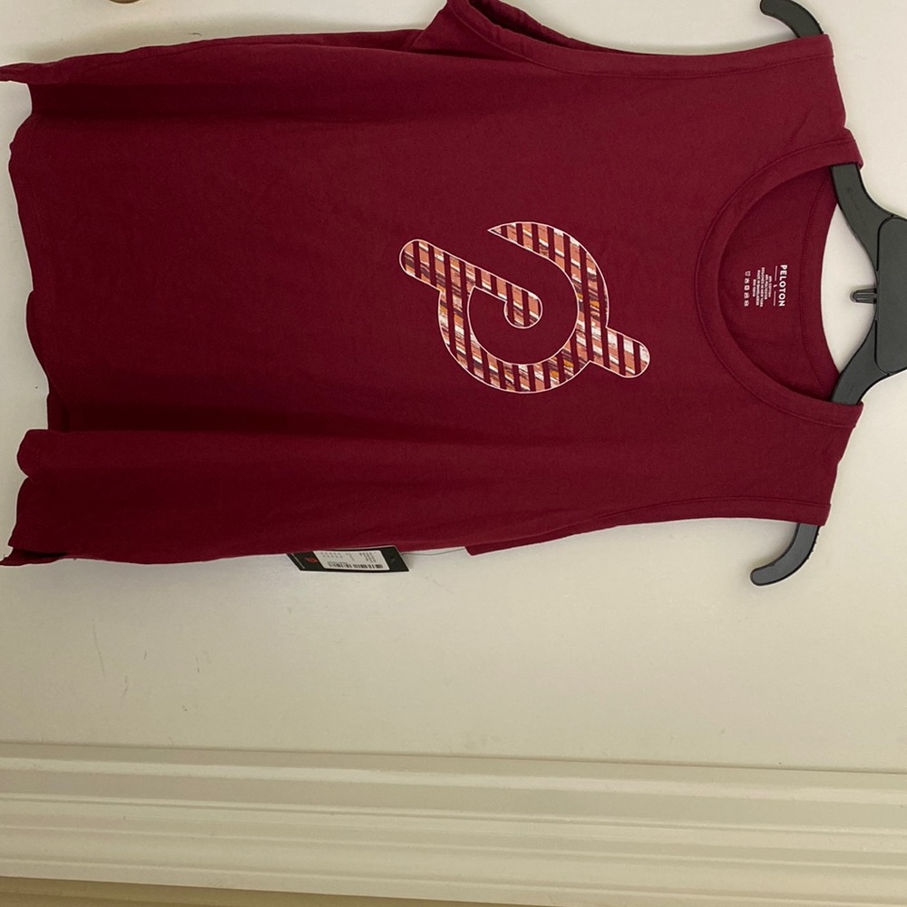 NWT. Peloton studio side slit muscle tank.
